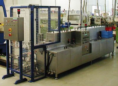 The throughput cleaning machine TW 108 for watery cleaning of lock cylinders 
by gun spraying